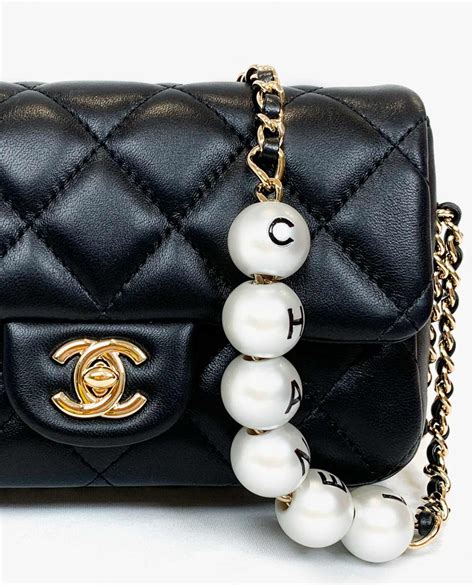 chanel bag pearl handle|chanel bag with pearl chain.